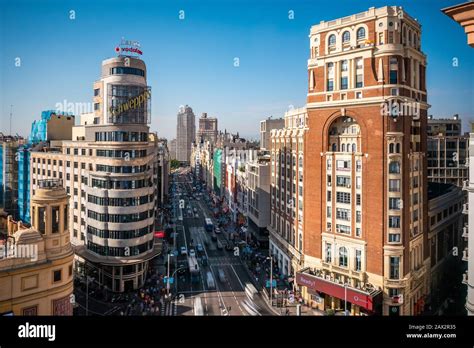 Landmark Buildings And Traffic On Gran Via Street In Central Madrid