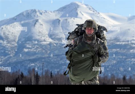 A Us Army Paratrooper Soldier Walks From The Drop Zone After