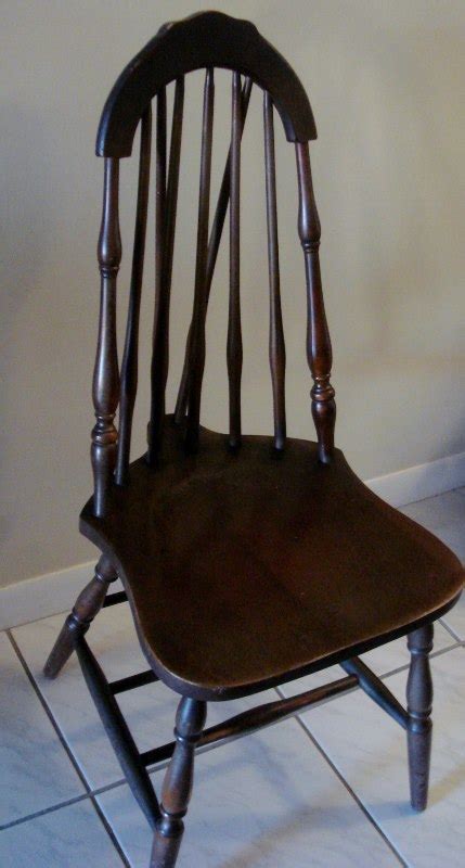 It is designed that way to fit the back rung which is round and is needed for proper connection. Brace Back Chair antique appraisal | InstAppraisal