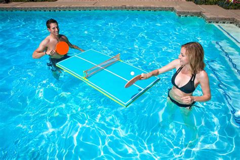 This Floating Ping Pong Table For The Pool Has Optional Legs For Use On Dry Land
