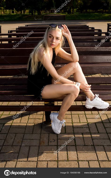 Fashionable Blonde Model In Stylish Clothes And White Sneakers P