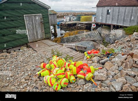 Buoys And Fishermens Sheds In Harbour At Blue Rocks Nova Scotia