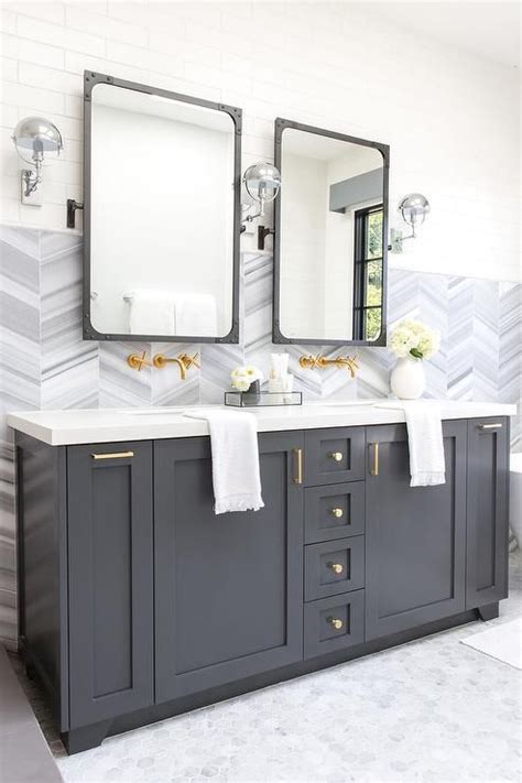 A Charcoal Gray Dual Bath Vanity Sits On Marble Hex Floor Tiles And Is