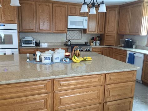 In my opinion this is too dark and once again just dates the space and makes it feel. Open kitchen with Quartz counters and oak cabinets ...