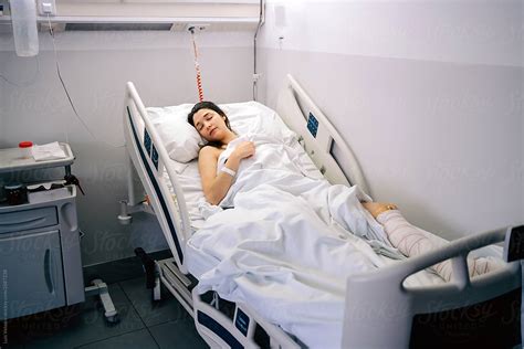 Female Patient Sleeping In A Hospital By Stocksy Contributor Luis Velasco Stocksy
