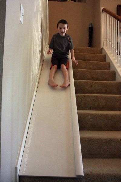 This family thought it was a good idea to have a big slide in their house. Remodelaholic | DIY Stair Slide, or How to Add a Slide to Your Stairs