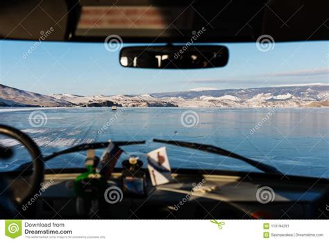 Driving On Ice Of Frozen Lake Baikal In Russia Travelling In Winter By