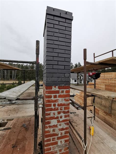 Installing House Chimney Blocks On The Rooftop Roofer Decorate And