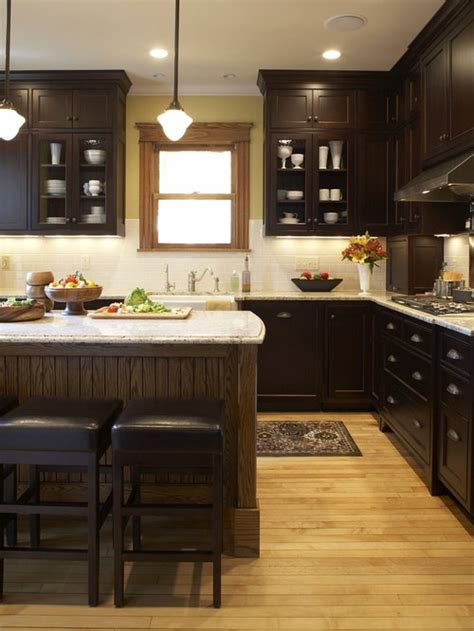 This kitchen features an almost black wooden flooring and cabinets. Dark Cabinets Light Floor Ideas, Pictures, Remodel and Decor
