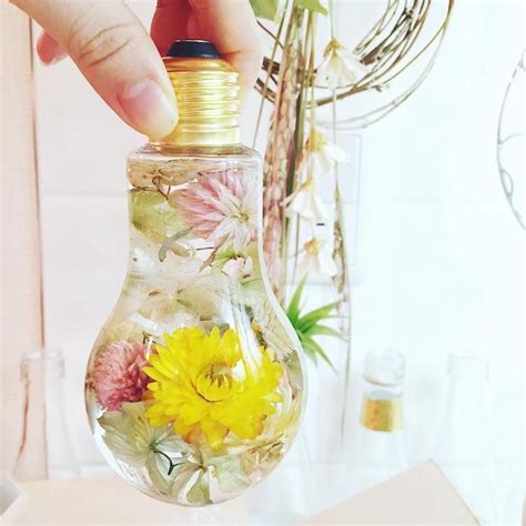 Enchanting Flowers Suspended In Light Bulbs Glisten Like Precious