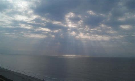 Sun Rays Over The Ocean Photograph By Deanna Sherrill
