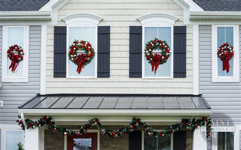 House with christmas wreaths on front door in beacon hill area. DIY Christmas Window Wreaths - Paint Yourself A Smile