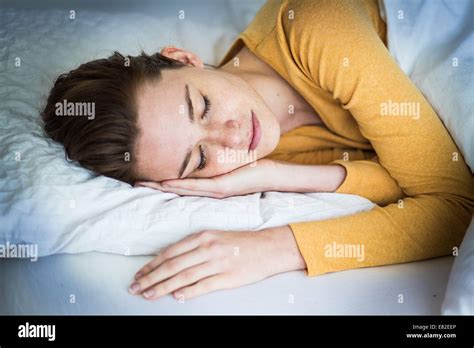 Woman Sleeping In Bed Stock Photo Alamy