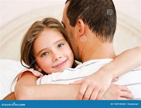 Smiling Happy Little Daughter Child Embracing Her Father Sharing Love