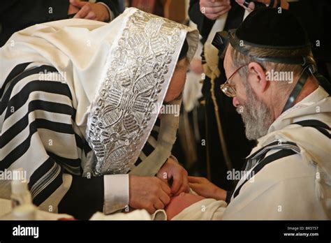 The Mohel Performs A Circumcision Ceremony On The 8th Day After Stock