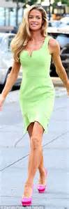 Denise Richards Displays Her Muscular Calves In Lime Green Dress As She