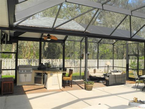 Outdoor kitchens can cost anywhere from a couple of thousand dollars to $100,000. Outdoor kitchen with extended roof. - Transitional - Patio ...