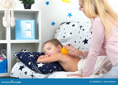 The Mother Makes The Massage Of The Back Of Her Little Son Stock Image Image Of Physical