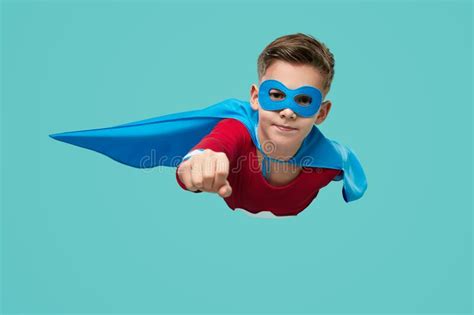 Superhero Boy Flying In Studio Stock Photo Image Of Energy