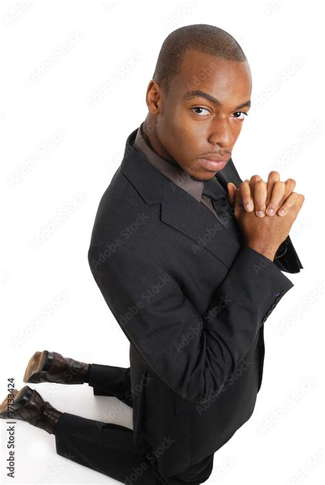 Business Man Kneeling Doing A Prayer Gesture Stock Photo Adobe Stock