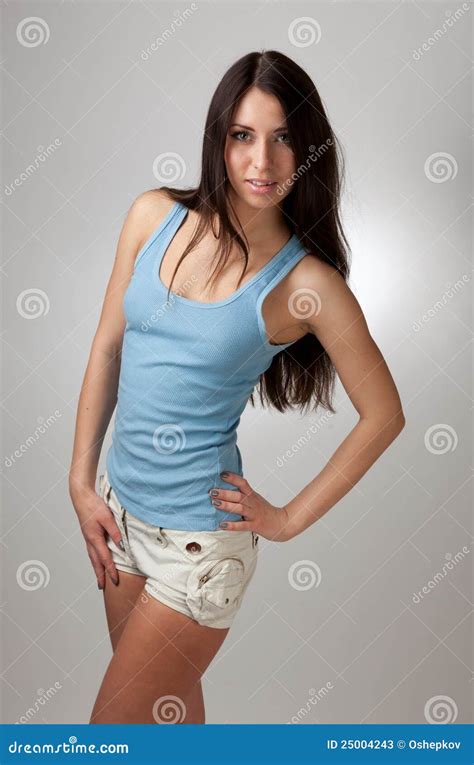 A Beautiful Girl In A Blue T Shirt With A Gray Bac Stock Image Image