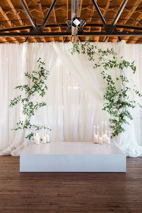 Rustic Draped Wedding Ceremony Backdrop With Modern Greenery And