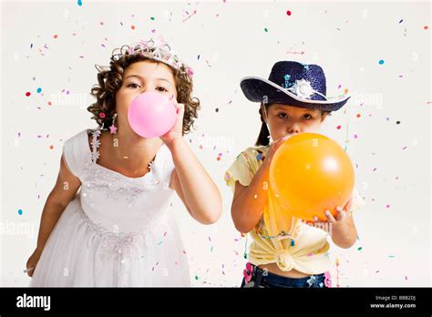 girls blowing up balloons telegraph