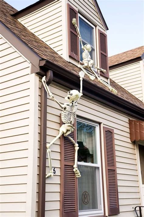 Skeleton Hanging From House Halloween Skeletons Outdoor Halloween
