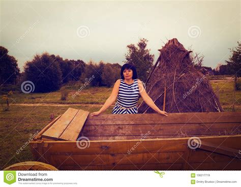 Brown Haired Middle Aged Woman In The Village Toning Stock Image