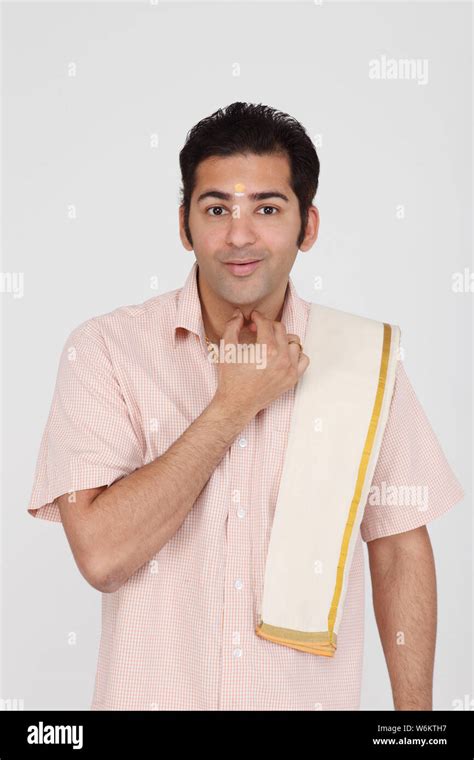 South Indian Man Swearing With Hand On Neck Stock Photo Alamy