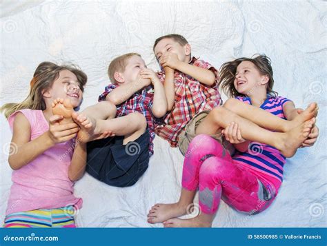 Girls Tickling Boys Feet Stock Image Image Of Boys Happy 58500985