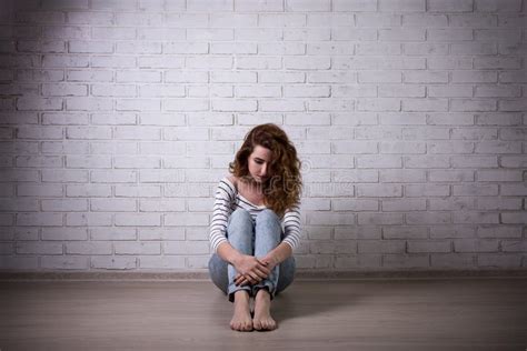Depression And Loneliness Sad Woman Sitting On The Floor Over Stock