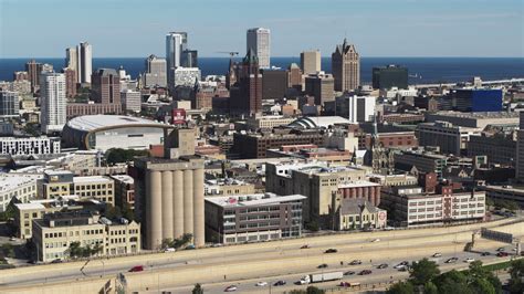 5 7k stock footage aerial video the city s skyline seen from the freeway in downtown milwaukee