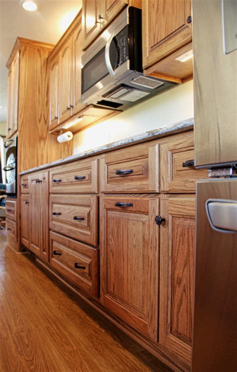 The eye is so drawn to the depth and drama of the color that you hardly even notice the laminate countertops, and the honey oak cabinets look… really. Custom Red Oak Kitchen With Cambria Quartz - Conneaut Lake ...
