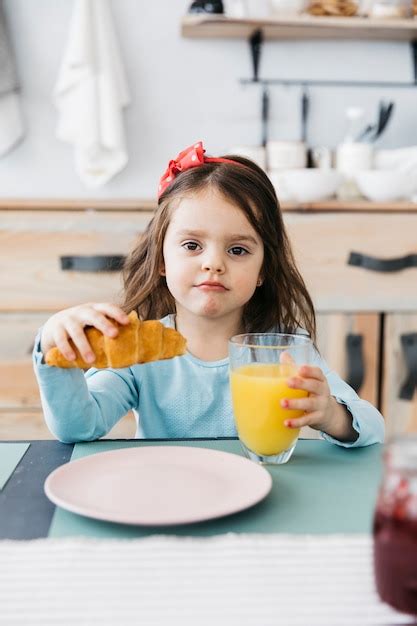 Free Photo Little Girl Having Her Breakfast