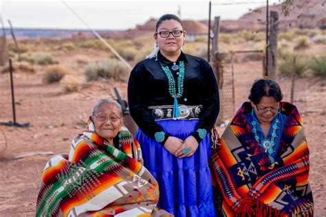 Native American Navajo Women Teenage Granddaughter Grandmother And Great Grandma Outside A