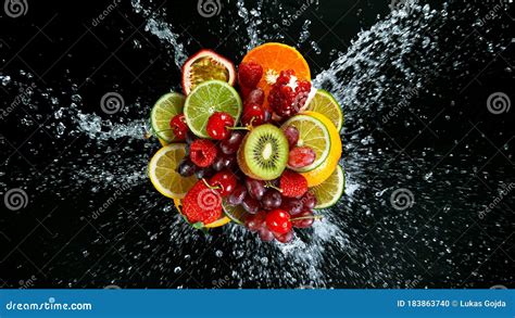 Super Slow Motion Shot Of Fresh Fruits With Splashing Water Stock Photo