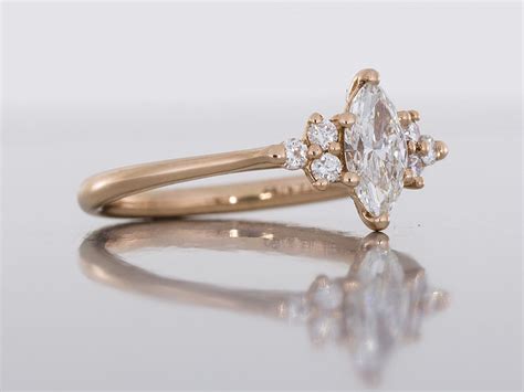 Delicate Rose Gold Engagement Ring Set With A Marquise Cut Diamond With