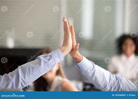 Close Up Of Colleagues Give High Five Celebrating Success Stock Image