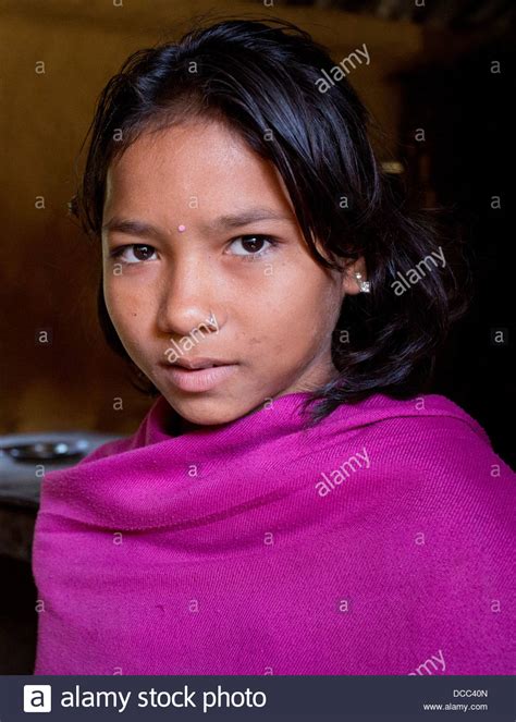 Young Girl Wearing A Handmade Pink Pashmina In A Tharu Village In The