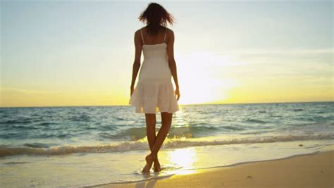 Pretty Girl In Sundress Reveling Being Alone By Ocean At Sunset On Beach Vacation Shot On Red