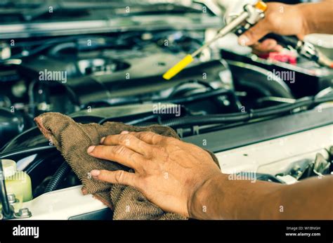 Man Holding A Car Engine Cleaning Kit Stock Photo Alamy