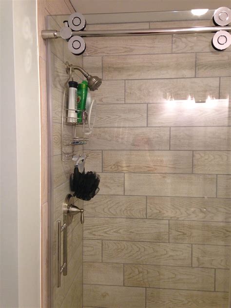 See more ideas about shower tile, shower stall, bathrooms remodel. Wood tile in shower stall _ marazzi Home Depot, glass door ...