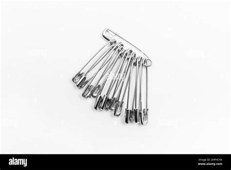 Pins Or Paper Clips To Remind You Of Objects On A White Background