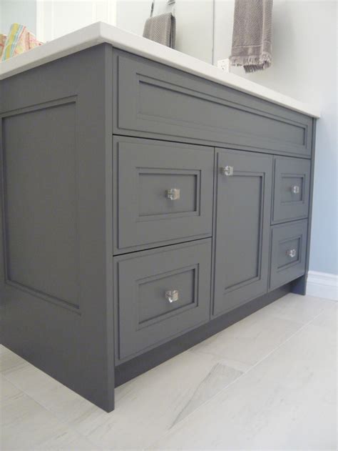 Look for countertops with a mix of both gray and brown hues. Bathrooms-Scotwend Homes Ltd.