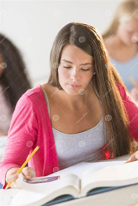 Student Studying At Desk In Classroom Stock Image Image Of