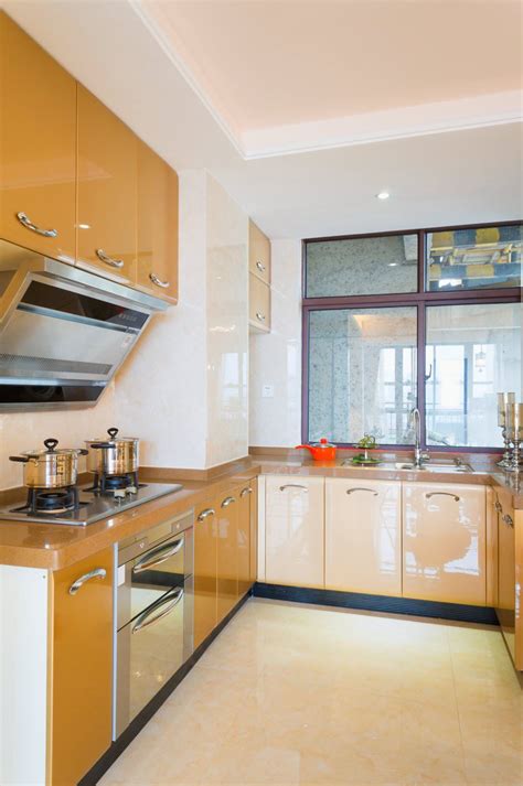 Sleek, glossy white cabinets add a modern touch. RAL 1007 Daffodil Yellow - High Gloss | Modern kitchen design, Modern kitchen, Kitchen cabinets