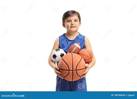 Little Boy Holding Many Balls From Different Sports Stock Photo Image
