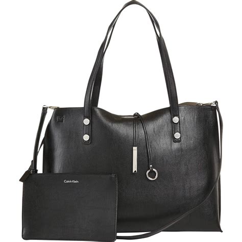 Change up your look any day of the week with this reversible faux leather tote. Calvin Klein Signature Logo Reversible Tote | Totes ...