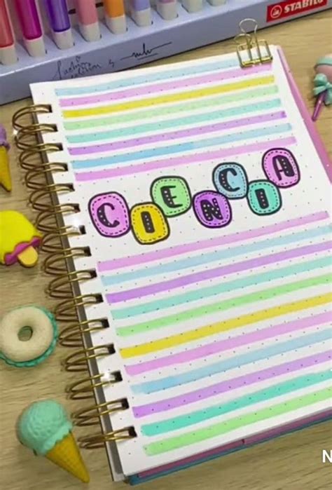 An Open Spiral Notebook With The Word Happy Written On It Next To